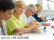 senior dental prothesis maker. Стоковое фото, агентство Ingram Publishing / Фотобанк Лори