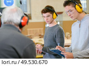 Woodwork apprenticeship. Стоковое фото, агентство Ingram Publishing / Фотобанк Лори