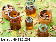 Healing tincture from pine kidneys.Medicinal tincture for colds.Herbal medicine. Bottles of tincture of pine buds. Стоковое фото, агентство Ingram Publishing / Фотобанк Лори