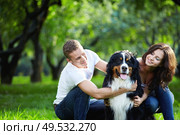 Portrait of a young couple with a dog. Стоковое фото, агентство Ingram Publishing / Фотобанк Лори