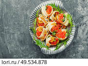 Festive, banquet pasta dish stuffed with red caviar.Macaroni stuffed with salmon caviar.. Red caviar filled pasta. Стоковое фото, агентство Ingram Publishing / Фотобанк Лори