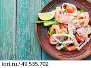 Seafood salad with prawns, mussels and squids. Delicious spicy seafood salad. Стоковое фото, агентство Ingram Publishing / Фотобанк Лори