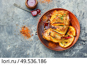 Roasted pork meat stuffed with orange and seasonings. Glazed roast pork meat in orange. Стоковое фото, агентство Ingram Publishing / Фотобанк Лори