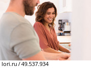 Modern and young couple cooking together at home. Стоковое фото, агентство Ingram Publishing / Фотобанк Лори