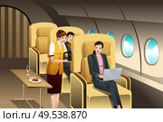 A vector illustration of First Class Passengers Being Served by the Flight Attendant. Стоковая иллюстрация, агентство Ingram Publishing / Фотобанк Лори