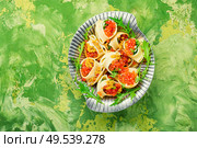 Festive, banquet pasta dish stuffed with red caviar.Macaroni stuffed with salmon caviar.. Red caviar filled pasta. Стоковое фото, агентство Ingram Publishing / Фотобанк Лори
