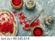 Exotic spice, saffron on a vintage oriental tray. Heap of saffron spice. Стоковое фото, агентство Ingram Publishing / Фотобанк Лори