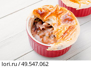 Baked seafood with bread cap.Squid and mussel julienne.Cream seafood soup.. Seafood soup or julienne. Стоковое фото, агентство Ingram Publishing / Фотобанк Лори