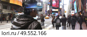 A person is using a high-tech VR headset amid the urban hustle of a busy cityscape, exploring a possibly augmented reality. Стоковое AI-изображение, AI-художник Данила Большаков / Фотобанк Лори