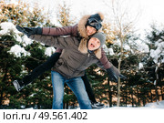 boy and girl outdoors on a winter walk playing snowballs and sledding. Стоковое фото, агентство Ingram Publishing / Фотобанк Лори