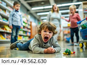 A little boy is lying on the floor in a store. Childish hysteria. The child screams, sobs, gets cranky and gets hysterical. Discontent. Стоковое AI-изображение, AI-художник Photojuli / Фотобанк Лори