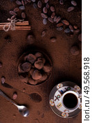 healthy delicious chocolate truffles around ingridients with natural cocoa beans,  powder, cacao butter, cane sugar and cup of coffee. healthy sweets concept. flat lay. Стоковое фото, агентство Ingram Publishing / Фотобанк Лори
