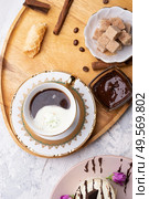 porcelain cup of coffee with pistachio ice cream  served  at table. life style concept. Стоковое фото, агентство Ingram Publishing / Фотобанк Лори