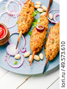 Lula kebab made from meat.Minced meat on the grill.Asian traditional meat dish. Lula kebab on stick. Стоковое фото, агентство Ingram Publishing / Фотобанк Лори