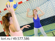 women during a game of handball. Стоковое фото, агентство Ingram Publishing / Фотобанк Лори