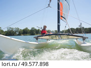 enjoying extreme sailing with racing sailboat. Стоковое фото, агентство Ingram Publishing / Фотобанк Лори