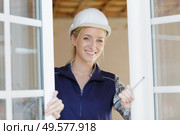 woman unscrews fastening screws handle. Стоковое фото, агентство Ingram Publishing / Фотобанк Лори