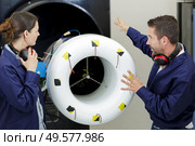 airplane service crew repairing plane in hangar. Стоковое фото, агентство Ingram Publishing / Фотобанк Лори