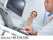 doctor and patient ultrasound equipment diagnostics sonography. Стоковое фото, агентство Ingram Publishing / Фотобанк Лори