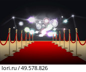 Red carpet colored and realistic composition with flashlights at the end of the carpet vector illustration. Стоковая иллюстрация, агентство Ingram Publishing / Фотобанк Лори
