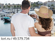 affectionate and passionate couple looking at boat. Стоковое фото, агентство Ingram Publishing / Фотобанк Лори
