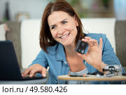 woman testing new small action camera. Стоковое фото, агентство Ingram Publishing / Фотобанк Лори
