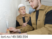Trainee plasterer at work. Стоковое фото, агентство Ingram Publishing / Фотобанк Лори