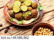 Falafel deep-fried balls made from chopped legumes or chickpeas. Falafel balls,vegetarian dish. Стоковое фото, агентство Ingram Publishing / Фотобанк Лори