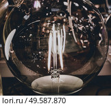 Modern and decorative Filament ligth bulb. Стоковое фото, агентство Ingram Publishing / Фотобанк Лори