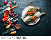 Seafood baked fish stuffed with broccoli,quinoa and tomato. Tasty baked whole fish. Стоковое фото, агентство Ingram Publishing / Фотобанк Лори
