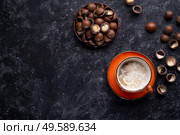 healthy natural  macadamia nuts dessert and coffee served at black table.food  and wellness concept . Стоковое фото, агентство Ingram Publishing / Фотобанк Лори