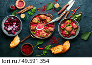 Arabic food lamb kufta spiced with saffron.Appetizing lamb meatballs. Kufta in cherry sauce. Стоковое фото, агентство Ingram Publishing / Фотобанк Лори