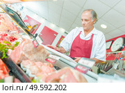 the butcher and the meat. Стоковое фото, агентство Ingram Publishing / Фотобанк Лори