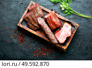 Italian meat platter.Cured meat and sausages on kitchen board. Set meat cured. Стоковое фото, агентство Ingram Publishing / Фотобанк Лори