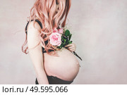   Young pregnant woman in her third trimester                             . Стоковое фото, агентство Ingram Publishing / Фотобанк Лори