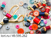 Set of buttons,spools of thread and other sewing accessories. Set sewing supplies,flat lay. Стоковое фото, агентство Ingram Publishing / Фотобанк Лори