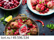 Delicious kufta or lamb meatballs in cherry sauce. Kufta in cherry sauce. Стоковое фото, агентство Ingram Publishing / Фотобанк Лори
