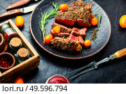 Beef steak roasted with kumquat and rosemary.Roasted meat. Succulent veal steak with kumquat. Стоковое фото, агентство Ingram Publishing / Фотобанк Лори