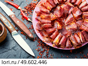 Sliced basturma or beef jerky.Horse meat jerky.Armenian cuisine. Beef cured and spice,basturma. Стоковое фото, агентство Ingram Publishing / Фотобанк Лори