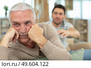 young compassionate man trying to talk to dad. Стоковое фото, агентство Ingram Publishing / Фотобанк Лори