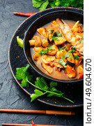 Tom yam kung thai seafood soup in bowl.Thai spicy soup with shrimp. Thai tom yum soup with shrimp. Стоковое фото, агентство Ingram Publishing / Фотобанк Лори
