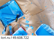 House renovation tools in blue paint stains on brown craft paper, do it yourself renovations. House renovation tools. Стоковое фото, агентство Ingram Publishing / Фотобанк Лори