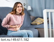 Young woman suffering from abdominal pain. Стоковое фото, фотограф Яков Филимонов / Фотобанк Лори