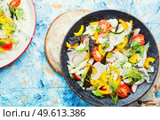 Spring fresh vegetable salad on rice paper.Vegetable oriental salad.. Vegetarian spring salad with fresh vegetables. Стоковое фото, агентство Ingram Publishing / Фотобанк Лори