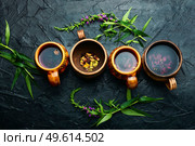 Cup of herbal tea on the table. Ivan tea or fireweed.Willow-herb. Therapeutic fireweed tea,fresh willow herb. Стоковое фото, агентство Ingram Publishing / Фотобанк Лори