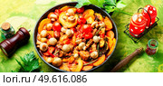 Spicy meat sauce with mushrooms, zucchini, tomato and potatoes. Stew meat. Ragout with meat and vegetables. Стоковое фото, агентство Ingram Publishing / Фотобанк Лори