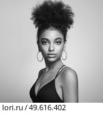 Beautiful smiling girl with curly hairstyle stock photo Women, African Ethnicity, Fashion Model, One Woman Only. Black and white photo. Стоковое фото, агентство Ingram Publishing / Фотобанк Лори