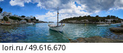 Panorama of small boats moored in the Mediterranean cove of Cala Alcaufar,Menorca, Стоковое фото, агентство Ingram Publishing / Фотобанк Лори