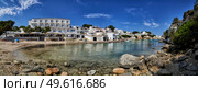 Panorama of beach,houses and small boats moored in the Mediterranean cove of Cala Alcaufar,Menorca, Стоковое фото, агентство Ingram Publishing / Фотобанк Лори
