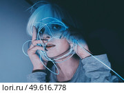 Weird dystopian theme portrait with blue neon lights. Стоковое фото, агентство Ingram Publishing / Фотобанк Лори